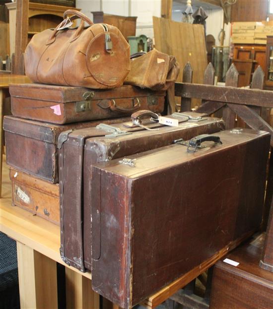 Five leather suitcases and two bags